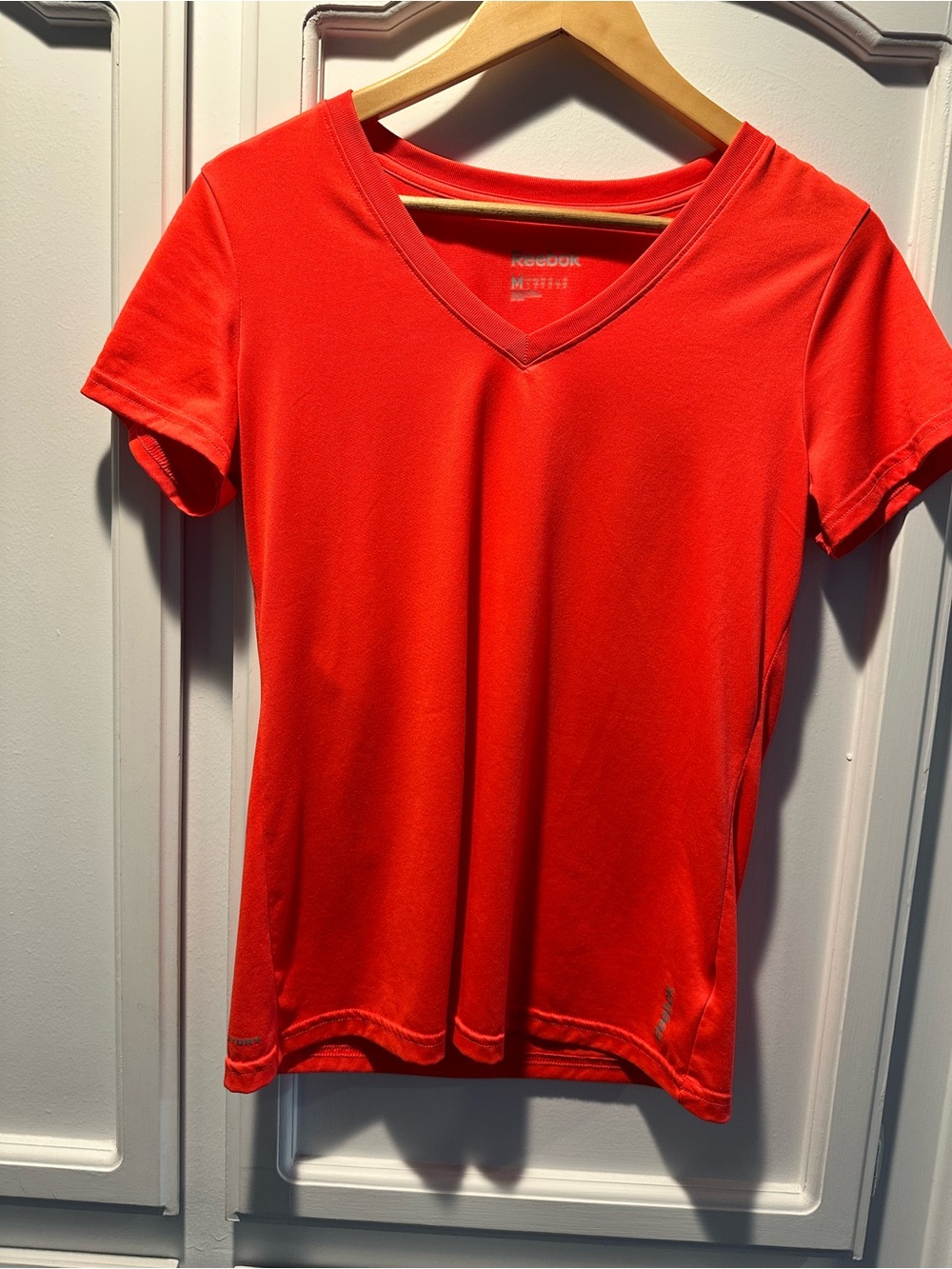Reebok Women's Bright Coral/Red V-Neck Short Sleeve Tee